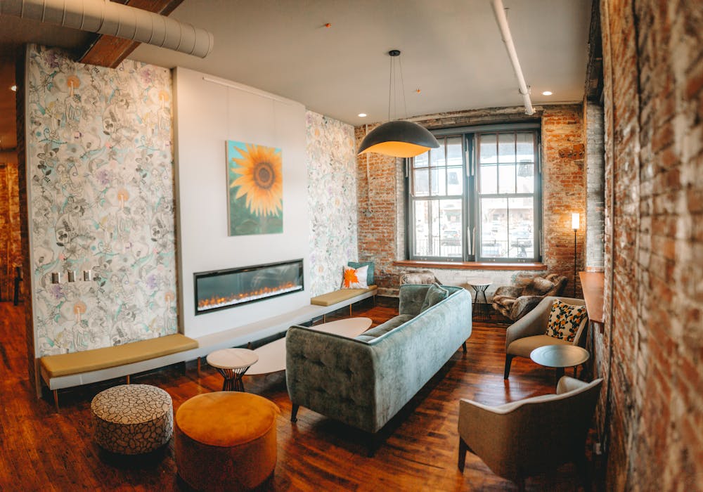 a living room filled with furniture and a fireplace